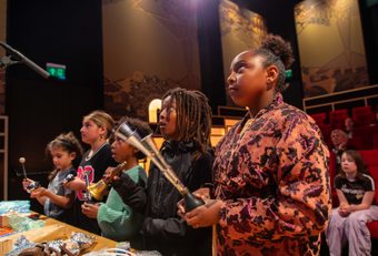 Children making sounds effects in cinima hall
