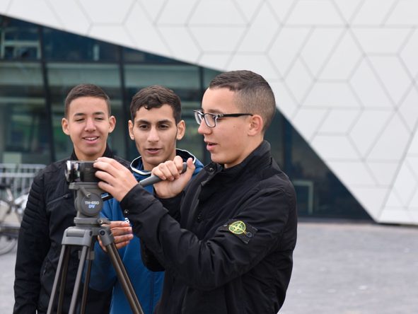students filming with camera