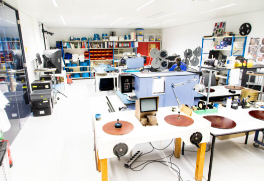 A large room contains several workstations where analogue film can be viewed and digitised in the Eye Collection Centre